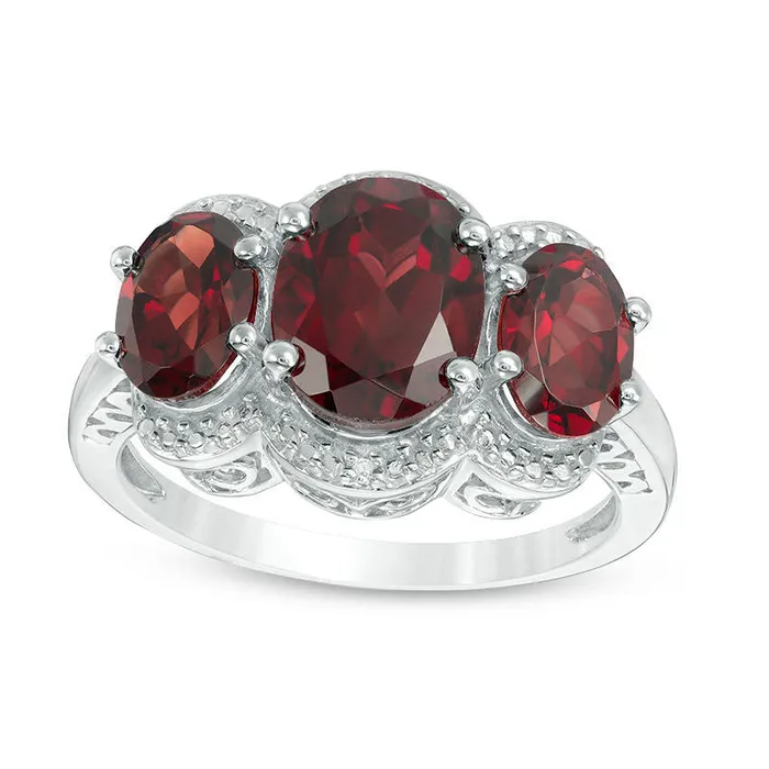 Oval Garnet and Natural Diamond Accent Three Stone Frame Ring in Sterling Silver Goldia Rings